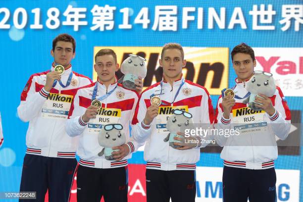 HANGZHOU, CHINA - DECEMBER 15:  Gold medalist team of Russia pose during ceremonies of the Men's Medley 4x50m Final on day 5 of the 14th FINA World Swimming Championships at Hangzhou Olympic Sports Expo on December 15, 2018 in Hangzhou, China.  (Photo by Lintao Zhang/Getty Images)